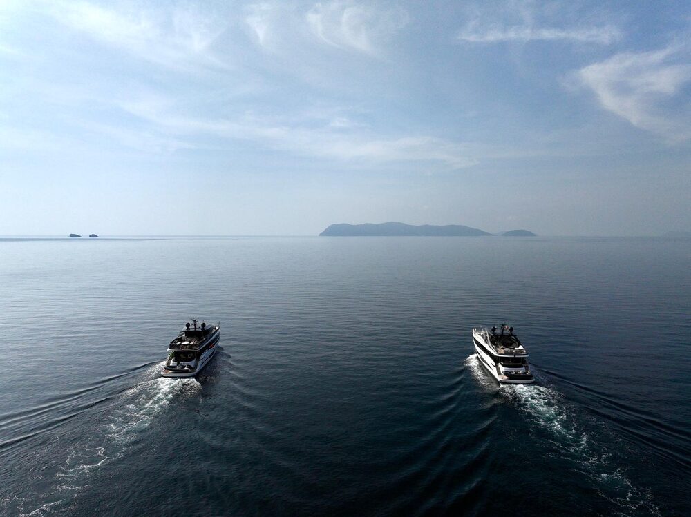 Two Princess Yacht boats cruising together on the water