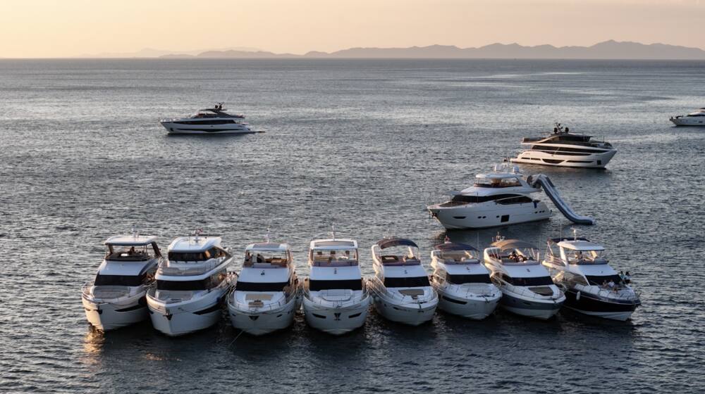 A fleet of Princess Yacht boats docked on the waters